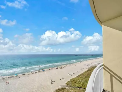 a view of the beach from the balcony of a condo at Aqua Resort 706 in Panama City Beach