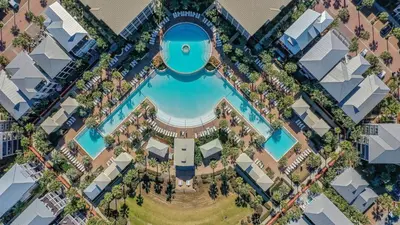 an aerial view of a resort with a swimming pool at 30A Emerald Waters by AvantStay Pool Bikes Bonfires in Panama City Beach
