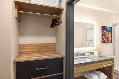 a bathroom with a sink and a mirror at Candlewood Suites Panama City - Tyndall AFB by IHG in Panama City