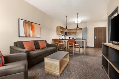 a living room with a couch and a table at Candlewood Suites Panama City - Tyndall AFB by IHG in Panama City