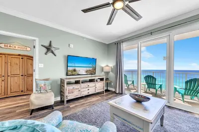 a living room with a tv and a couch at Grandview East 1002 in Panama City Beach