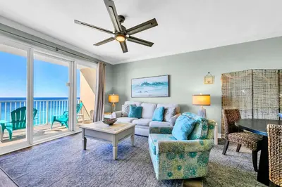 a living room with a couch and a table at Grandview East 1002 in Panama City Beach