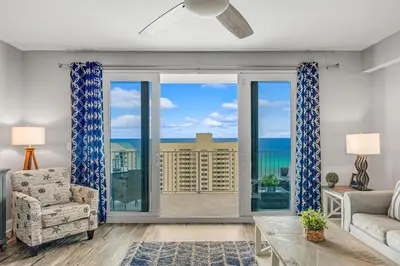 a living room with a view of the ocean at Laketown Wharf #1219 by Nautical Properties in Panama City Beach