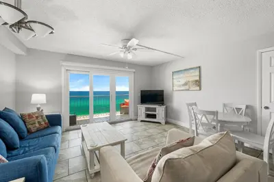 a living room with a view of the ocean at Summit #1105 by Nautical Properties Vacation Rentals in Panama City Beach