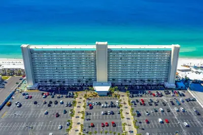 a large building with a lot of cars in front of it at Summit #1105 by Nautical Properties Vacation Rentals in Panama City Beach