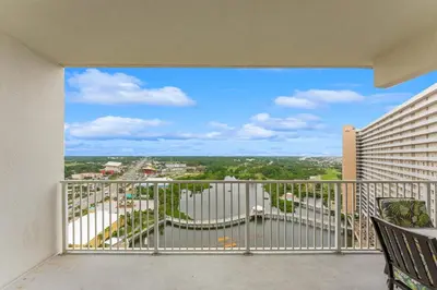 a balcony with a view of a city at Laketown Wharf #1531 by Nautical Properties in Panama City Beach