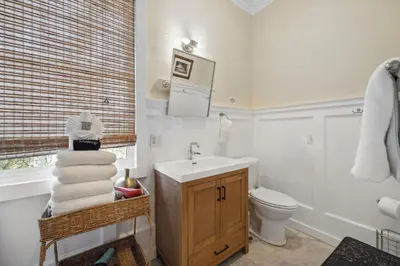 a bathroom with a sink and a toilet at 67 Wiggle Lane - Rosemary Beach - Steps to Tennis Courts, Beach, Pools! in Rosemary Beach