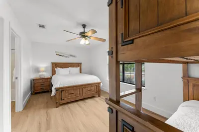 a bedroom with a bed and a ceiling fan at Casa de Tortugas - a spacious townhome with 30a private beach access in Seacrest