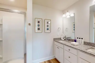 a bathroom with a sink and a shower at Steps to Sand and Surf! Family-Friendly PCB Retreat in Panama City Beach