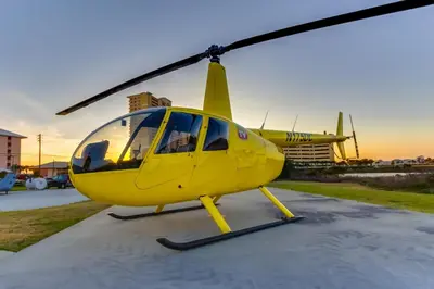 a yellow helicopter sitting on top of a parking lot at Steps to Sand and Surf! Family-Friendly PCB Retreat in Panama City Beach