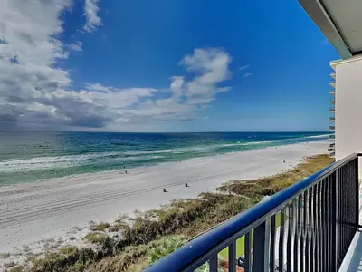 a view of the beach from the balcony of a condo at Mariner East #602 in Panama City Beach