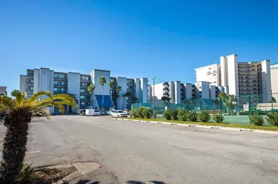an empty street in a city with tall buildings at Mariner East #602 in Panama City Beach