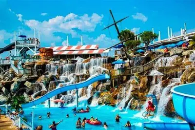 a water slide at a water park with people in it at Calypso 2109 West Corner Unit with incredible gulf views for miles in Panama City Beach