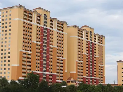 a large apartment building with many windows at 2007 Calypso East 1 Bedroom in Panama City Beach