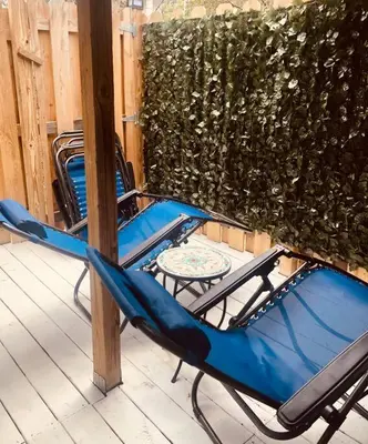 two chairs and a table on a patio at Beachy Bungalow, Santa Rosa Beach, FL near Gulf in Santa Rosa Beach
