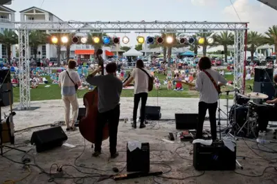 a group of people playing music at a concert at Beachy Bungalow, Santa Rosa Beach, FL near Gulf in Santa Rosa Beach