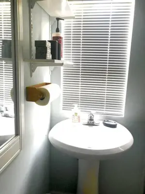 a bathroom with a white sink and a window at Beachy Bungalow, Santa Rosa Beach, FL near Gulf in Santa Rosa Beach