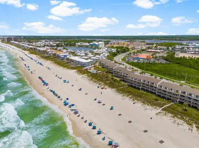 an aerial view of a beach with umbrellas and the ocean at Dreamscape 30! Luxury Beach Front Property! in Panama City Beach
