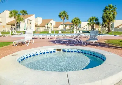 a swimming pool with chairs and a swimming pool at Horizon South 56 - 206 in Panama City Beach