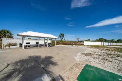 a pavilion with a picnic table and a picnic table at Beautiful Beach Front Condo at Pinnacle Port A-125 in Panama City Beach