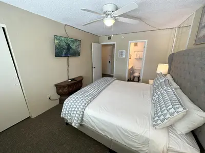 a bedroom with a bed and a ceiling fan at Beautiful Beach Front Condo at Pinnacle Port A-125 in Panama City Beach