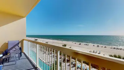 a balcony with a view of the beach at Calypso I 407E in Panama City Beach