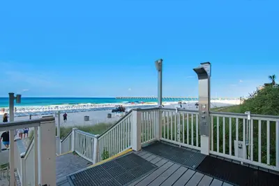 a deck with a view of the beach at Calypso I 407E in Panama City Beach