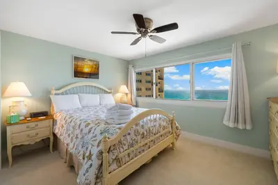 a bedroom with a bed and a window at Fabulous 3-Bed 3-Bath Condo with Private Covered Parking Space! in Panama City Beach