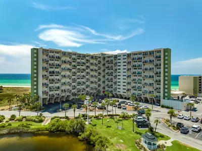 an aerial view of a building at the beach at Fabulous 3-Bed 3-Bath Condo with Private Covered Parking Space! in Panama City Beach