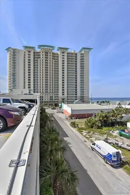 a view of a street with cars parked in front of tall buildings at Aqua 511 in Panama City Beach