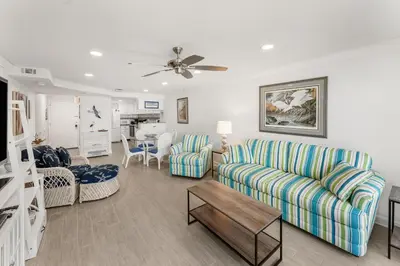 a living room with a couch and a table at Beautiful Beach Front Paradise at Pinnacle Port B2-608! in Panama City Beach