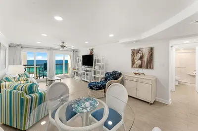 a living room with a view of the ocean at Beautiful Beach Front Paradise at Pinnacle Port B2-608! in Panama City Beach