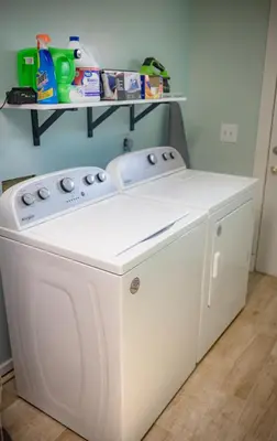 a white washer and dryer in a room at Panhandle Paradise, Heated Pool, Hot Tub, Mini & Disc Golf, Game Room in Panama City Beach