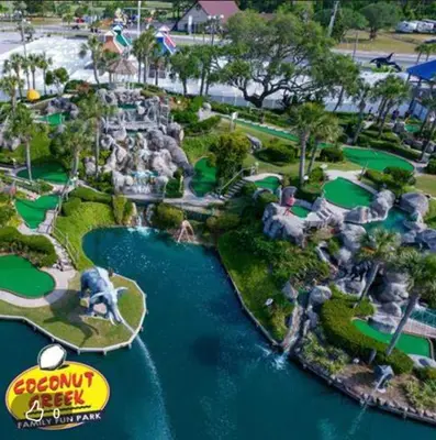 an aerial view of a golf course at a resort at Our Happy Place! Seasonal Beach SRV! Pool & Gulf Views! in Panama City Beach