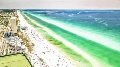 an aerial view of a beach with the ocean at Emerald Beach 1835 in Panama City Beach