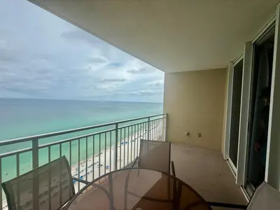 a balcony with a view of the beach and the ocean at Emerald Beach 1935 in Panama City Beach