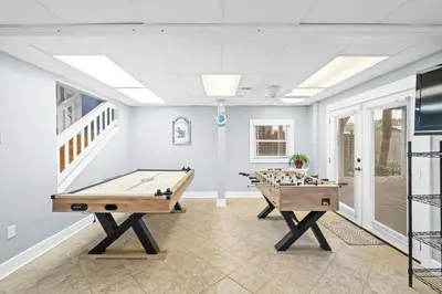 a room with two ping pong tables in it at Lagoon Cocune by Book That Condo in Panama City Beach