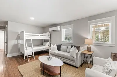 a living room with a couch and a bunk bed at Pool On 30A Gulf Views Balconies Luxury in Inlet Beach