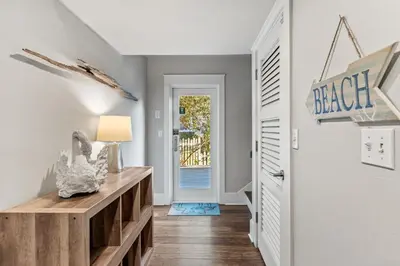 a hallway with a door with a sign that reads black at Pool On 30A Gulf Views Balconies Luxury in Inlet Beach