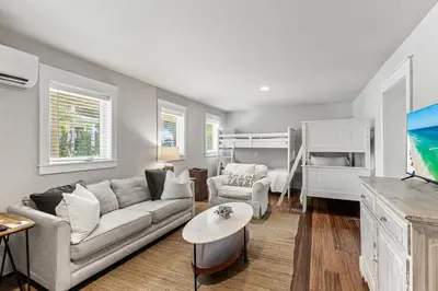 a living room with a couch and a bunk bed at Pool On 30A Gulf Views Balconies Luxury in Inlet Beach