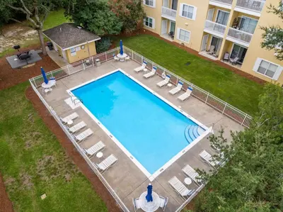 an overhead view of a large swimming pool in a yard at Fun Beach Condo on 30A with POOL and Lake and Beach Access in Santa Rosa Beach