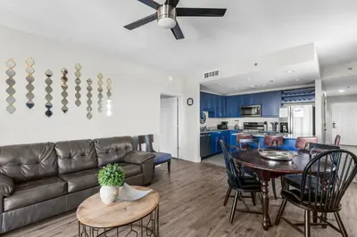 a living room with a couch and a table at Laketown Wharf #0938 in Panama City Beach