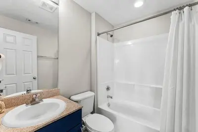 a bathroom with a sink and a toilet and a shower at Laketown Wharf #0938 in Panama City Beach