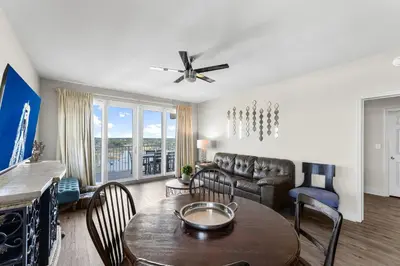 a living room with a table and a couch at Laketown Wharf #0938 in Panama City Beach