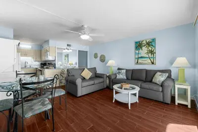 a living room with a couch and a table at The Summit 408 in Panama City Beach