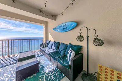 a living room with a couch and a view of the ocean at Grand Panama 1-1807 in Panama City Beach