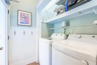 a laundry room with a washer and dryer at Tucked Away in Inlet Beach