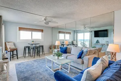 a living room with a couch and a table at Regency Towers PCB Condo Beach Access and 2 Pools in Panama City Beach