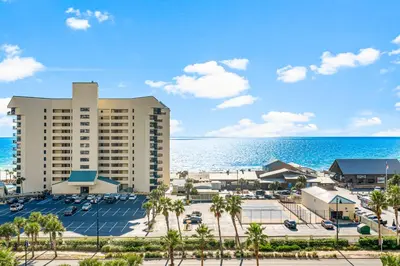 a view of a resort with palm trees and the ocean at Laketown Wharf #624 Beautiful Gulf View by Nautical Properties in Panama City Beach
