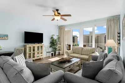 a living room with couches and a flat screen tv at Laketown Wharf #624 Beautiful Gulf View by Nautical Properties in Panama City Beach